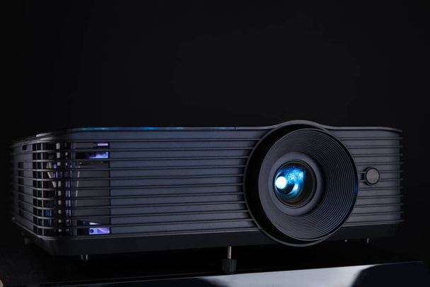 Modern video projector on black background - Photo, Image