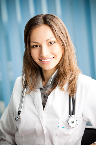 Young happy smiling successful female doctor - Фото, изображение