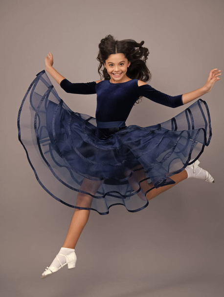 Excited face, cheerful emotions of teenager girl. Happy teenager, positive and smiling emotions. Full length of excited teenager child in summer dress jump isolated on gray background studio - Photo, Image