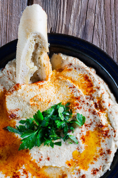 Fresh hummus with parsley and oil. - Photo, Image