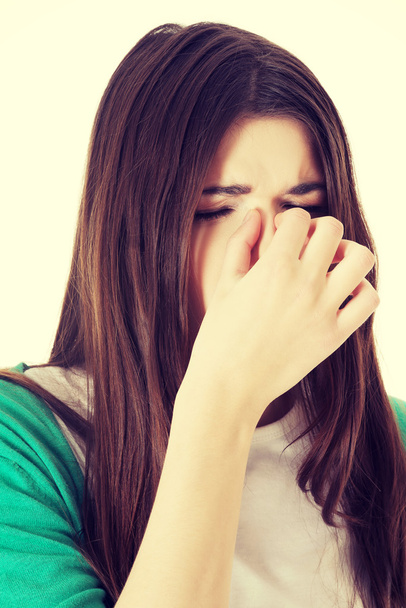 Young woman with sinus pressure. - Foto, afbeelding