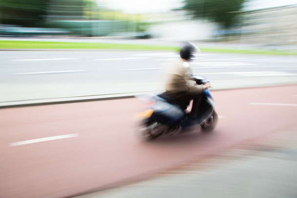 Scooterist in motion blur - Fotó, kép