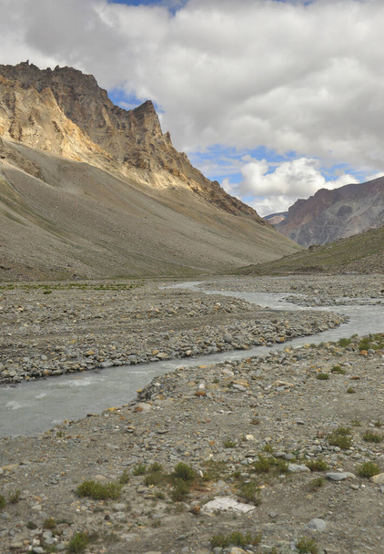 Beautiful Landscape view of flowing a river in between Dry mountains of Leh, Ladakh with cloudy sky in summer. - Foto, immagini