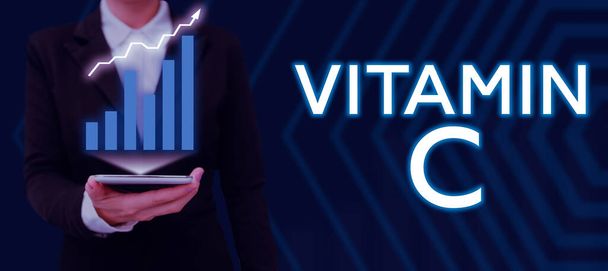 Scrittura di visualizzazione del testo Vitamina C, vetrina aziendale promuove la guarigione e aiuta il corpo ad assorbire l'acido ascorbico ferro - Foto, immagini