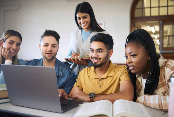 Laptop, study and students with group project for online course, e learning and education with diversity, happy and teamwork. Research video, studying and university student friends in a classroom. - Photo, Image