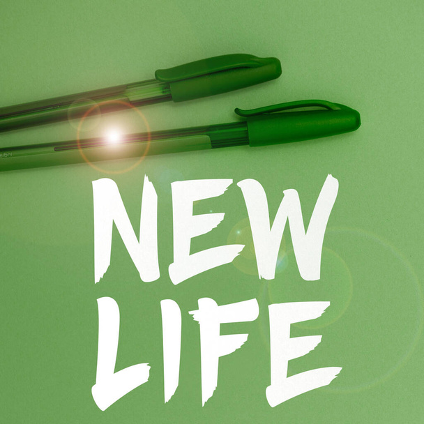 Написание от руки знак "Новая жизнь", бизнес-витрина начало изменений в существовании человека или животного - Фото, изображение