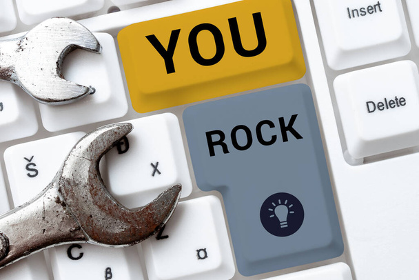 Text sign showing You Rock, Internet Concept slang phrase of praise or encouragement conveying you are awesome - Photo, Image