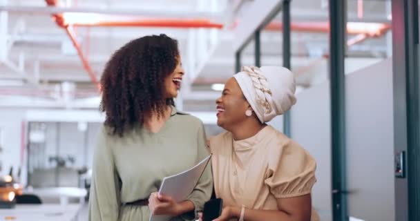 Black women, laughing or walking with business technology, paper or documents in modern office, coworking space or marketing company. Smile, happy or comic creative designers bonding in slow motion. - Footage, Video