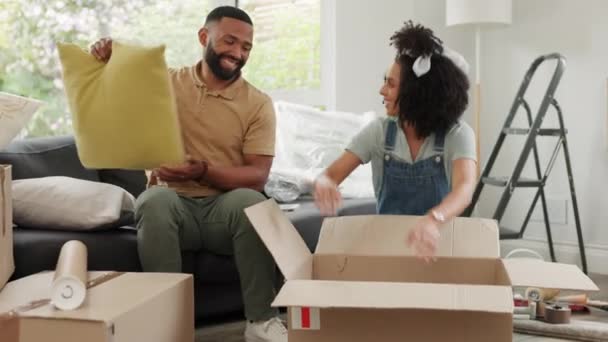 Black couple, moving out and tape box after packing to move to new home, house or apartment. Property real estate, relocation and mortgage investment of happy man and woman helping to seal boxes - Materiał filmowy, wideo