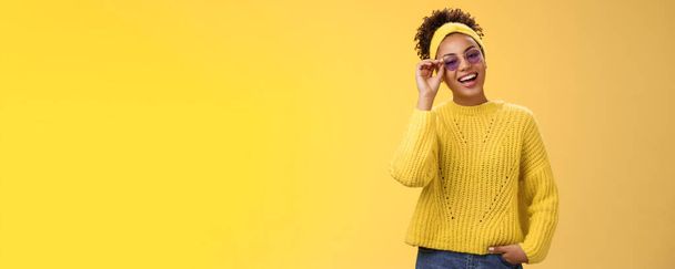 Stylish chill confident modern millennial teenage girl sweater headband blue sunglasses touching glasses frames smiling broadly assertive self-assured look grinning delighted hold hand pocket. - Photo, Image