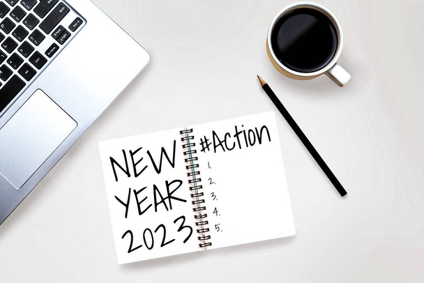2023 Happy New Year Resolution Goal List and Plans Setting - Business office desk with notebook written about plan listing of new year goals and resolution setting. Koncepcja zmiany i ustalenia. - Zdjęcie, obraz
