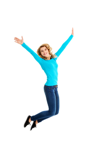 Young casual woman, student jumping. - Foto, imagen