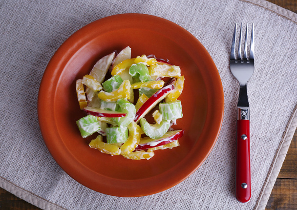 Waldorf salad with salad pepper on plate on table close up - 写真・画像