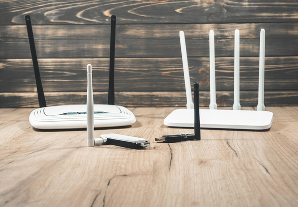 Different types of Wi-Fi routers, modern and old technology. Wireless ethernet connection signal. USB Wifi Receiver Wireless Network Card. High Speed Antenna Wifi Adapters. - Photo, Image