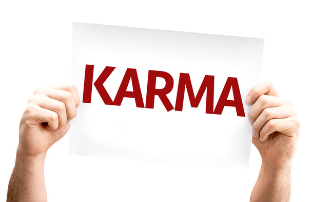Tarjeta de Karma en las manos
 - Foto, Imagen