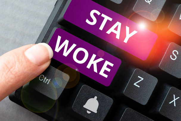 Text sign showing Stay Woke, Business idea being aware of your surroundings and things going on Keep informed - Photo, Image