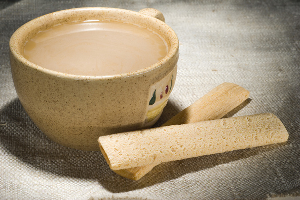 Cup of milk coffee with crusty sticks - Fotografie, Obrázek