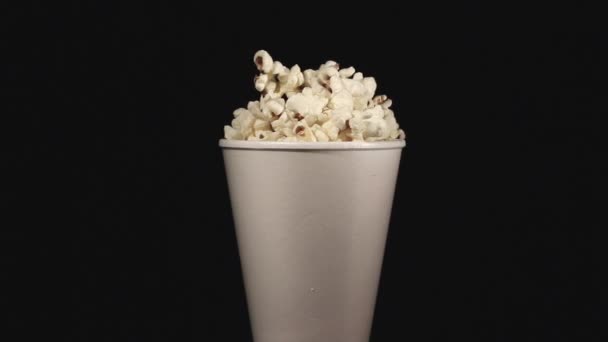The white glass with popcorn rotates - Video