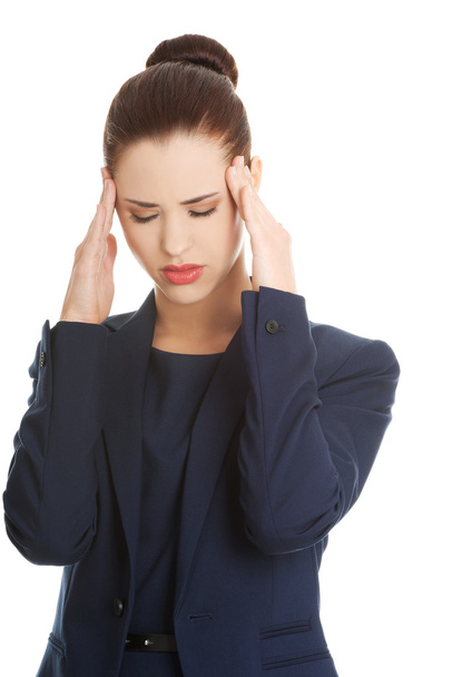 Young woman suffering a headache - Foto, Imagen