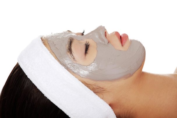 Relaxed woman with a nourishing face mask - Foto, immagini