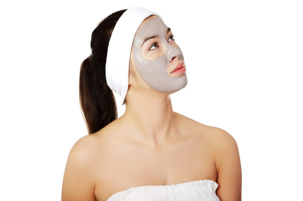 Relaxed woman with a nourishing face mask - Fotografie, Obrázek