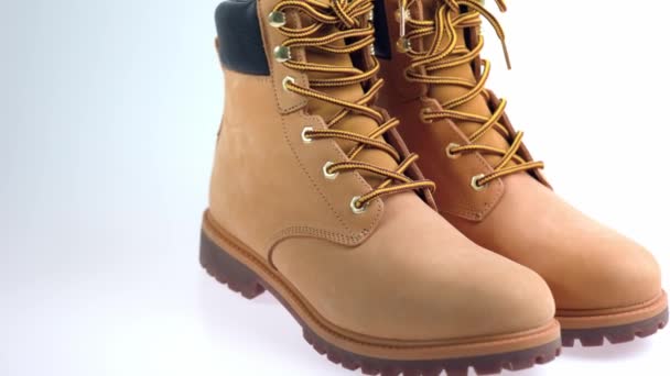 Close up view of yellow  men's boots isolated on background. - Footage, Video