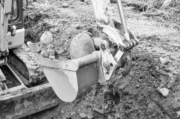 екскаватор копає яму
 - Фото, зображення