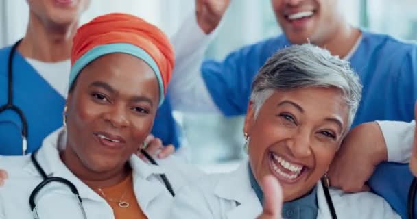Doctor, team and face with smile for teamwork, collaboration or fun laughing in about us at hospital. Group of healthcare experts laugh and smiling in happiness for medical success or team building. - Filmagem, Vídeo