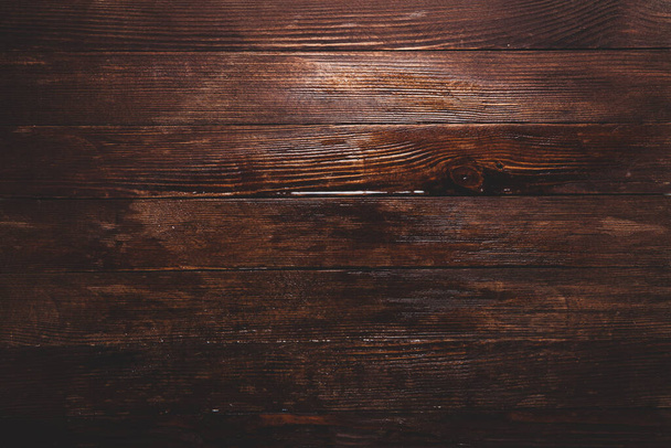 Vintage barna fa háttér textúra csomókkal és körömlyukakkal. Régi festett fa fal. Barna absztrakt háttér. Vintage fa sötét vízszintes lapok. - Fotó, kép