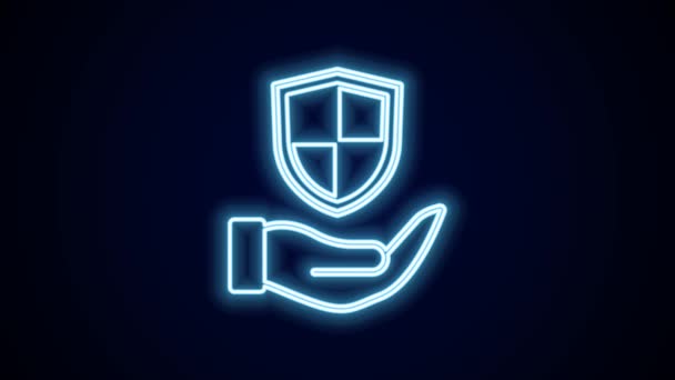 Glowing neon line Shield in hand icon isolated on black background. Insurance concept. Guard sign. Security, safety, protection, privacy concept. 4K Video motion graphic animation. - Footage, Video