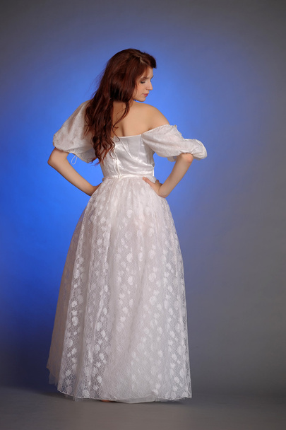 Beautiful Young Woman in a white dress. In the studio. - Foto, Imagem