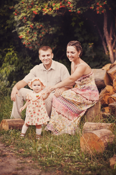 Happy mother, father and daughter outdoor - Photo, image
