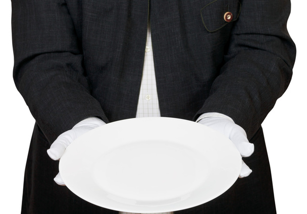 vista frontal del plato blanco vacío en las manos con guantes
 - Foto, imagen