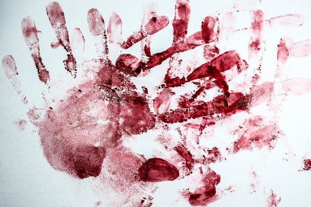 Red Bloody fingerprints and palm print  on the white background. Horror and crime scene concept. Halloween postcard. - Photo, Image
