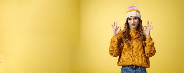 You look awesome. Portrait satisfied good-looking girl show okay gesture delighted good result, excellent perfect work, assuring no problem, smiling devious check out cool shot, yellow background. - Photo, Image
