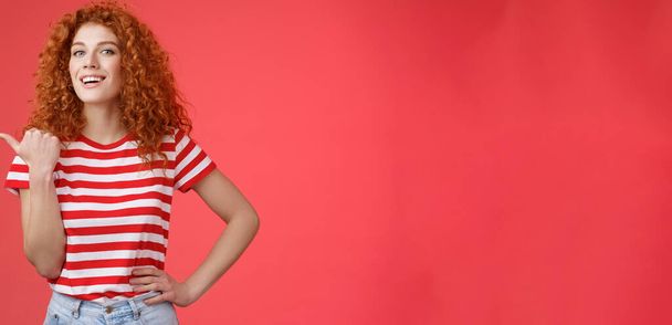Accomplished good-looking redhead curly woman raise head proudly confident pointing thumb left smiling camera assertive sharing awesome product location recommend perfect store offer. - Photo, Image