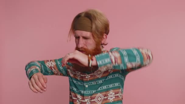 Dont want to hear and listen. Frustrated annoyed irritated hippie man covering ears and gesturing no, avoiding advice ignoring unpleasant noise loud voices. Hipster redhead guy on pink background - Footage, Video