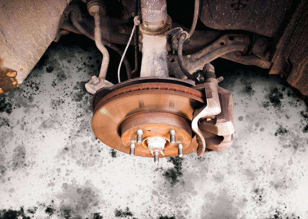 Rusty car brake discs without wheels, car brake system repair in the auto repair garage, automotive maintenance service concept - Photo, Image