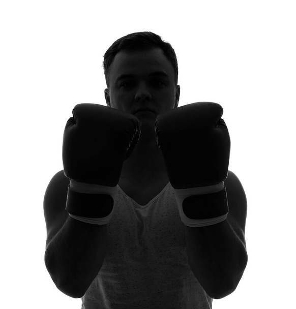 Silhouette sportos fiatalember boksz kesztyű fehér háttér - Fotó, kép