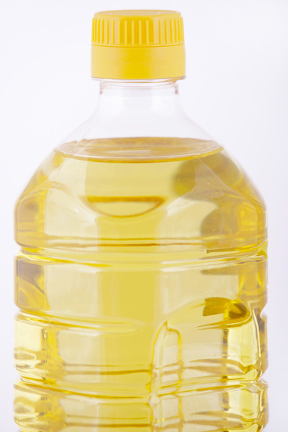 Bottle of oil on a white background isolated - Photo, image