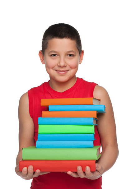 Happy young boy holds books - Φωτογραφία, εικόνα