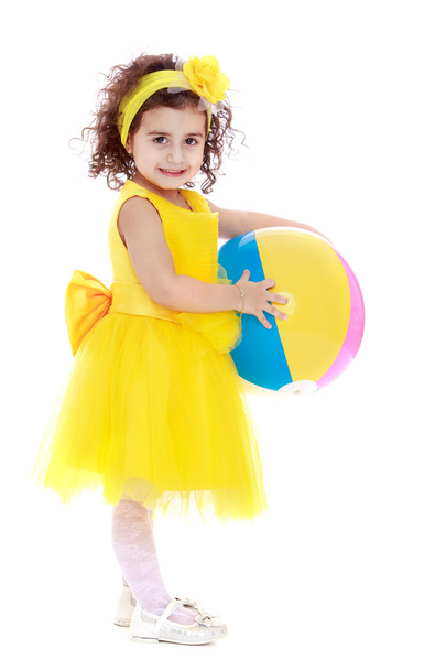 Adorable little girl in a yellow dress - Фото, зображення