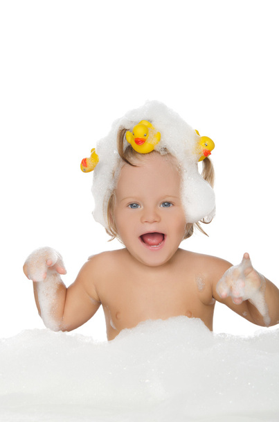 Happy girl with ducks and soap foam - Φωτογραφία, εικόνα