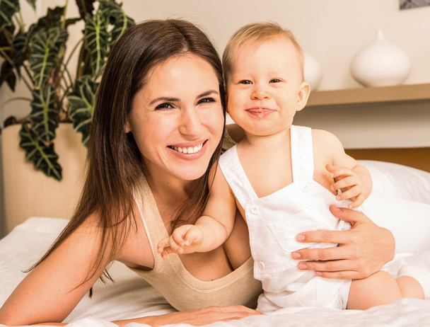 Portrait of young mother  with her charming son - Photo, Image