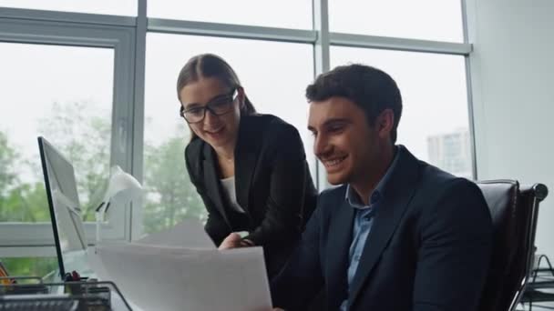 Managers team check report profitable results closeup. Happy workers celebrate successful contract in office. Cheerful colleagues businesspeople analyzing documents together. Corporate victory concept - Footage, Video