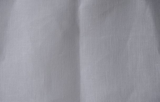 Gebleekt wit linnen Stof. Verfrommeld organisch linnen. Natuurlijke levensstijl. Kopieerruimte. - Foto, afbeelding