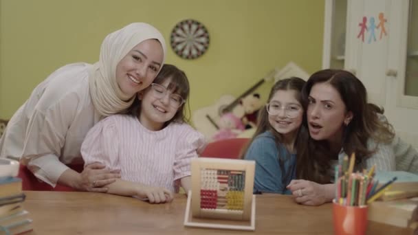 Mother and daughters playing with cute little abacus. Children playing with wooden abacus at home. Kids having fun with educational preschool toy. - Záběry, video