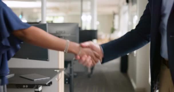 Handshake, partnership and business people with deal, agreement or collaboration in office. Closeup of professional corporate employees shaking hands for onboarding, greeting or welcome in workplace - Footage, Video