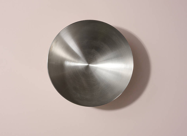 Empty round metal bowl on beige background, top view - Photo, Image