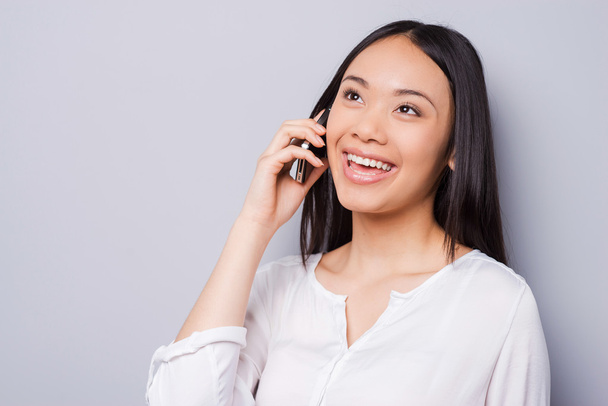 Asian woman talking on mobile phone - Photo, Image
